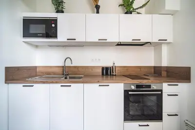 Cuisine ou kitchenette dans l'établissement MM Suites Centre Bacquenois