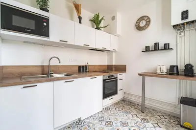 Cuisine ou kitchenette dans l'établissement MM Suites Centre Bacquenois