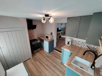 Cuisine ou kitchenette dans l'établissement La petite Flânerie