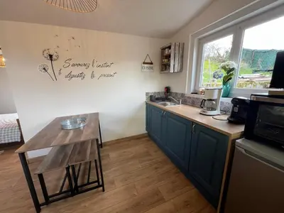 Cuisine ou kitchenette dans l'établissement le chalet du bonheur