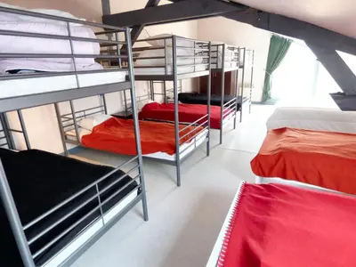 Un ou plusieurs lits dans un hébergement de l'établissement Retraite Champêtre Spacieuse près de Nouart avec Jacuzzi