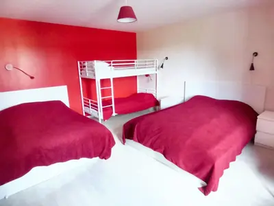 Un ou plusieurs lits dans un hébergement de l'établissement Retraite Champêtre Spacieuse près de Nouart avec Jacuzzi