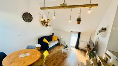 Coin salon dans l'établissement Logement cosy et confortable.