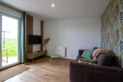 Télévision ou salle de divertissement dans l'établissement Superbe cottage proche Disney