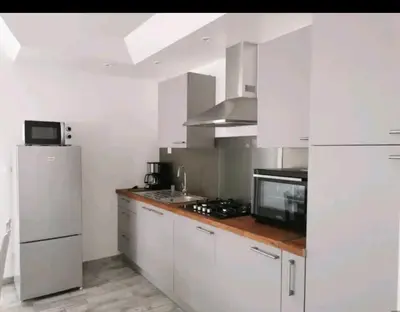 Cuisine ou kitchenette dans l'établissement La petite maison