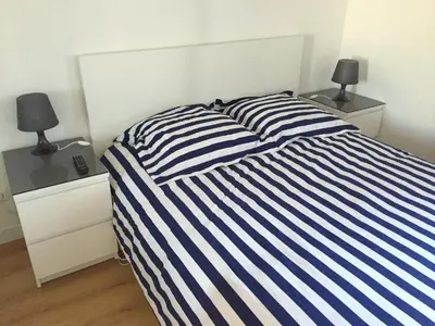 Un ou plusieurs lits dans un hébergement de l'établissement Magic Apartments