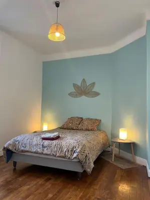 Un ou plusieurs lits dans un hébergement de l'établissement Appartement cœur de ville