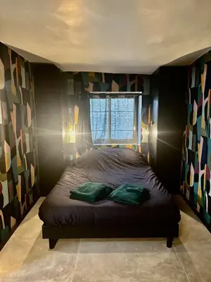 Un ou plusieurs lits dans un hébergement de l'établissement Studio luxe dans le vignoble