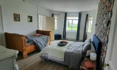 Un ou plusieurs lits dans un hébergement de l'établissement La Villa Beausejour