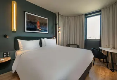 Un ou plusieurs lits dans un hébergement de l'établissement Radisson Hotel Reims