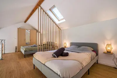 Un ou plusieurs lits dans un hébergement de l'établissement Cottage les Ecuries, pleine nature, proche Disney-Paris
