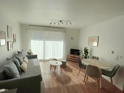 Coin salon dans l'établissement Lovely Flat