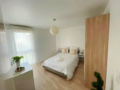 Un ou plusieurs lits dans un hébergement de l'établissement Lovely Flat