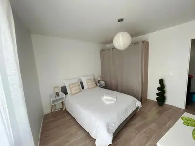 Un ou plusieurs lits dans un hébergement de l'établissement Lovely Flat