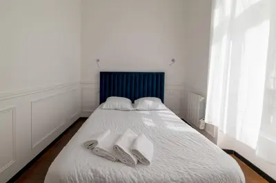 Un ou plusieurs lits dans un hébergement de l'établissement Reims Cathédrale Hyper Centre