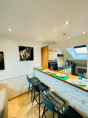 Cuisine ou kitchenette dans l'établissement Le Rousseau