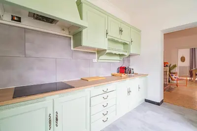 Cuisine ou kitchenette dans l'établissement Le Seventies - Exceptionnel 4 chambres & billard