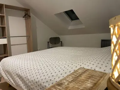 Un ou plusieurs lits dans un hébergement de l'établissement Bel appartement 2 chambres