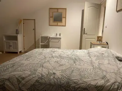 Un ou plusieurs lits dans un hébergement de l'établissement Bel appartement 2 chambres