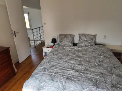 Un ou plusieurs lits dans un hébergement de l'établissement Appartement 6 personnes au calme à 25minutes de disney