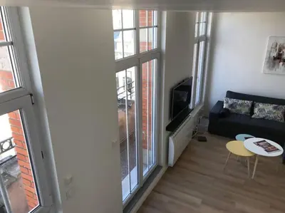 Télévision ou salle de divertissement dans l'établissement Le duplex de Talleyrand Hyper Centre