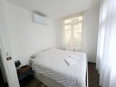 Un ou plusieurs lits dans un hébergement de l'établissement Suite Chanzy 69