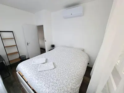Un ou plusieurs lits dans un hébergement de l'établissement Suite Chanzy 69