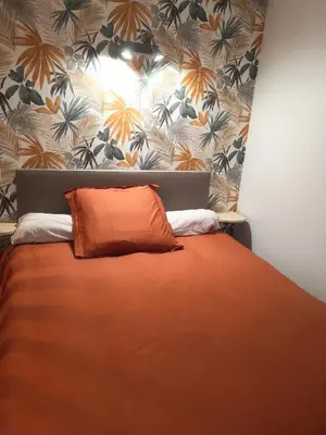 Un ou plusieurs lits dans un hébergement de l'établissement Appartement des Charmilles, Compiègne hyper-centre