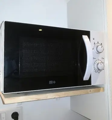 Cuisine ou kitchenette dans l'établissement Appartement des Charmilles, Compiègne hyper-centre
