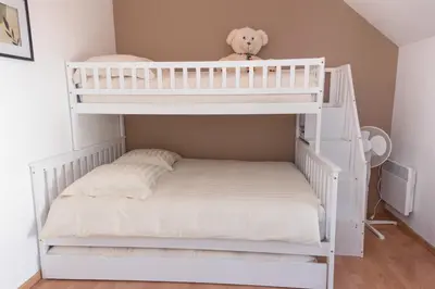 Un ou plusieurs lits dans un hébergement de l'établissement Maison avec grand jardin, la Celle-sur-Morin
