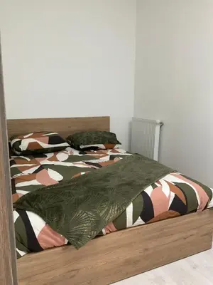 Un ou plusieurs lits dans un hébergement de l'établissement Kezy appartement 4 personne bébé