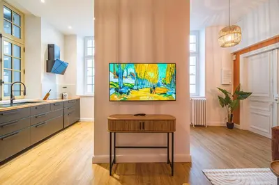 Télévision ou salle de divertissement dans l'établissement MM Suites Loft Cathédrale