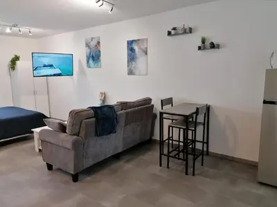Coin salon dans l'établissement LaSweetHouseBleutée Tout confort