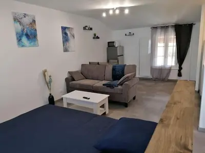 Coin salon dans l'établissement LaSweetHouseBleutée Tout confort