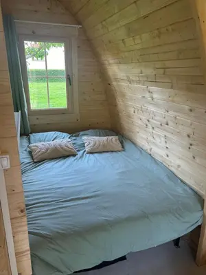 Un ou plusieurs lits dans un hébergement de l'établissement La pod de mon jardin