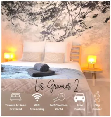 Un ou plusieurs lits dans un hébergement de l'établissement NOUVEAU Les Grumes 2 - Maison - 2 chambres - Jardin - Neuf