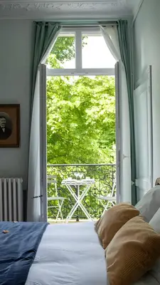 Un ou plusieurs lits dans un hébergement de l'établissement Appartement vintage - Reims centre