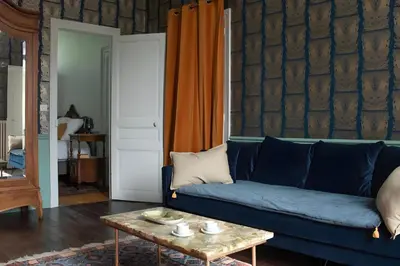 Coin salon dans l'établissement Appartement vintage - Reims centre