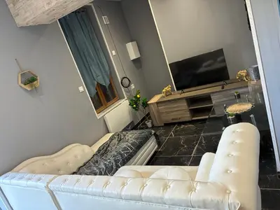 Télévision ou salle de divertissement dans l'établissement Gîte de L'océan