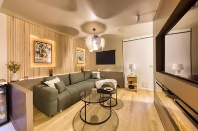 Télévision ou salle de divertissement dans l'établissement Relax House & SPA - DISNEY
