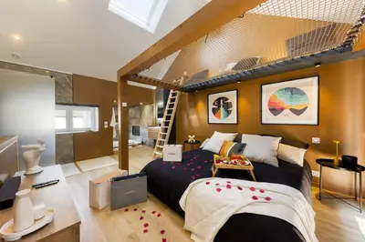 Un ou plusieurs lits dans un hébergement de l'établissement Relax House & SPA - DISNEY