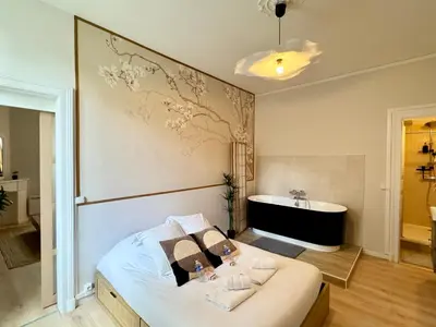 Un ou plusieurs lits dans un hébergement de l'établissement Relax Inn Champagne - Reims Balnéo