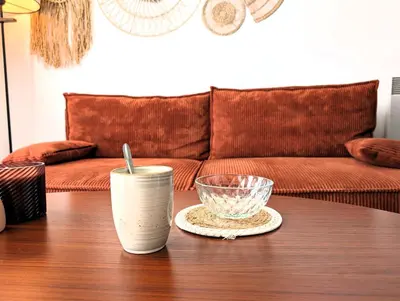 Coin salon dans l'établissement Cozy House - 15 min Disneyland - 2 Parkings - Fibre