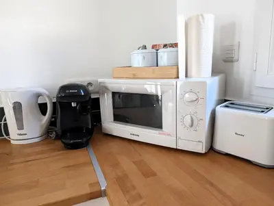 Cuisine ou kitchenette dans l'établissement Cozy House - 15 min Disneyland - 2 Parkings - Fibre