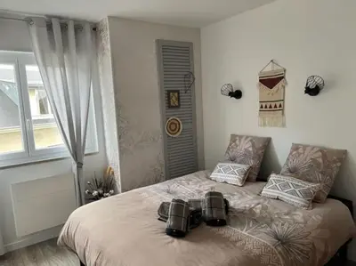 Un ou plusieurs lits dans un hébergement de l'établissement L'appart' Centre ville 3 chambres