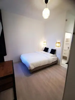 Un ou plusieurs lits dans un hébergement de l'établissement Le 288 - Appartements Reimois