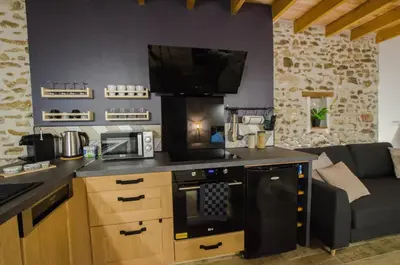 Cuisine ou kitchenette dans l'établissement Le Petit Candie