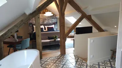 Télévision ou salle de divertissement dans l'établissement Maison d'hôtes Café Bulle