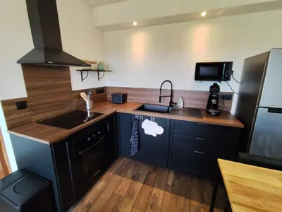 Cuisine ou kitchenette dans l'établissement Logement en pleine nature à la campagne