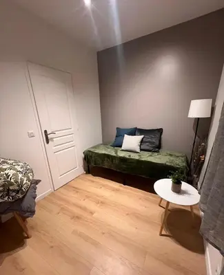 Un ou plusieurs lits dans un hébergement de l'établissement ZenkaSerenity-Ferme paisible Centre CHU-wifi-pro